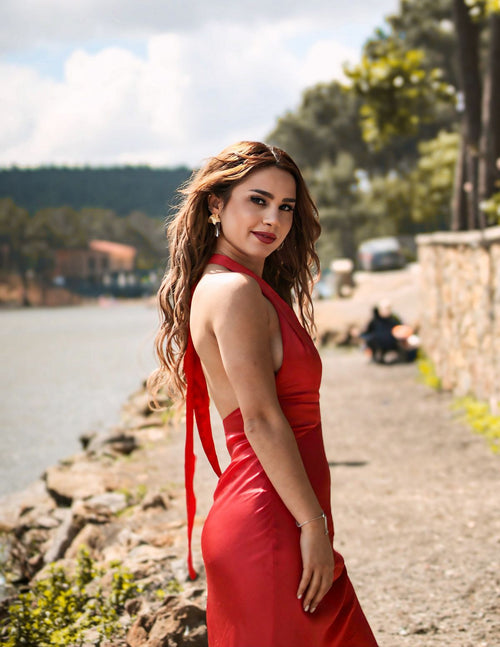 Woman in a flowing red dress outdoors